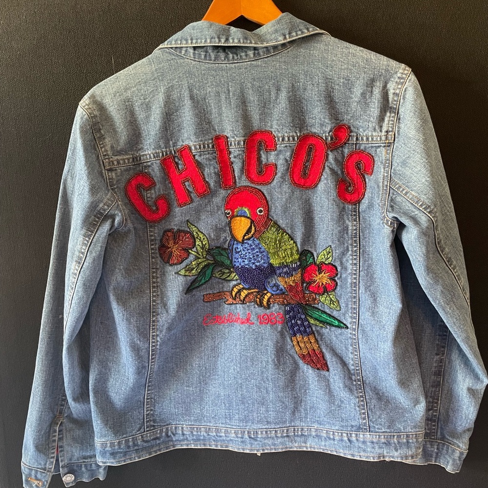 Chico's 1983 Anniversary Embroidered Denim Jacket with Parrot Design. Size 1